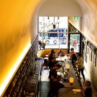 A shot from the mezzanine of Leigh Street Wine Room with its high curved ceiling and yellow glow